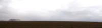 a cloudy sky is seen over a deserted area